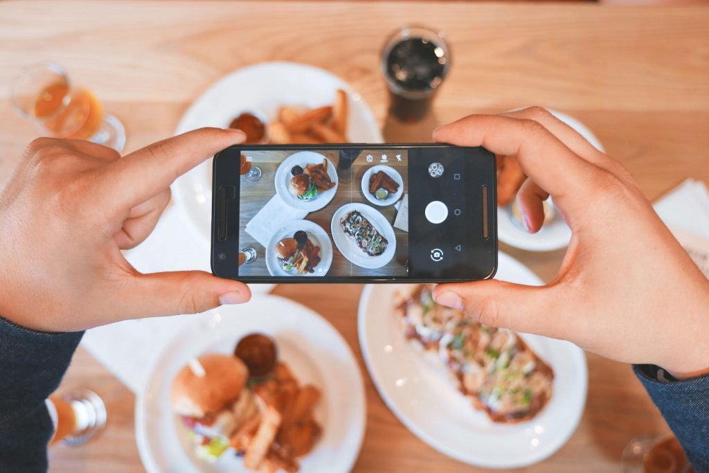 restaurant table with mobile and food