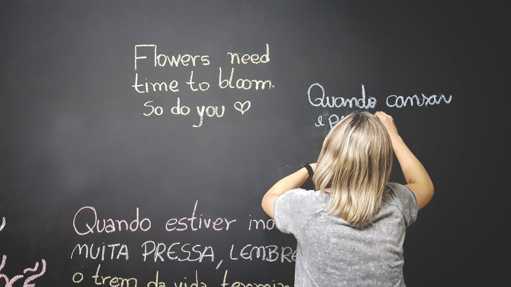 girl writing on the board