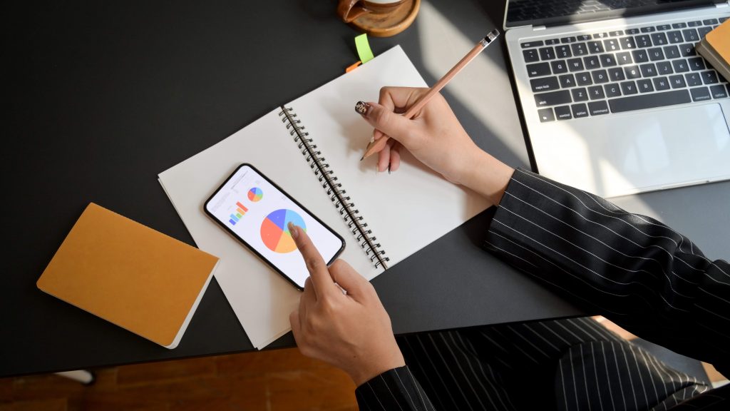 girl with pencil paper and mobile